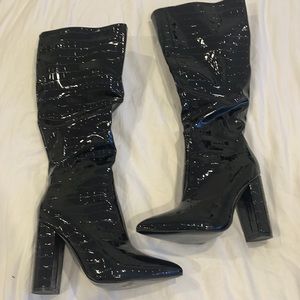 Over the knee heeled black snake print boots